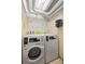 Shared laundry room showcasing modern appliances and ample space at 555 E 10Th Ave # 111, Denver, CO 80203