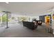 Spacious lounge featuring a spiral staircase, comfortable seating, and large windows providing ample natural light at 555 E 10Th Ave # 111, Denver, CO 80203