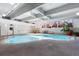 Inviting indoor pool area with natural light, plants, seating, and a tranquil atmosphere for relaxation at 555 E 10Th Ave # 111, Denver, CO 80203
