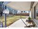 Covered back patio featuring a table and seating, ideal for outdoor dining and relaxation at 377 Stuart St, Denver, CO 80219