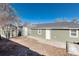 View of the home's exterior with a small shed in the backyard and gravel landscaping at 377 Stuart St, Denver, CO 80219