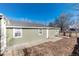 Backyard view of the home featuring neutral siding and simple landscaping at 377 Stuart St, Denver, CO 80219