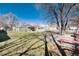 Large backyard featuring healthy green lawn and shady trees at 377 Stuart St, Denver, CO 80219
