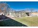 Wide-angle backyard view showcasing well-kept grass and fencing, offering privacy and space at 377 Stuart St, Denver, CO 80219