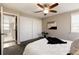 Spacious bedroom with a comfortable bed, sliding closet doors, and an ensuite bathroom, offering convenience and privacy at 377 Stuart St, Denver, CO 80219