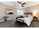 Inviting bedroom with a comfortable bed, soft lighting, and a ceiling fan at 377 Stuart St, Denver, CO 80219