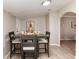 Well-lit dining area with modern table set and an open archway to another room at 377 Stuart St, Denver, CO 80219