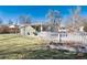 Quaint home with a cozy front yard, complemented by a charming white picket fence and lush green grass at 377 Stuart St, Denver, CO 80219