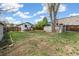 Large backyard with grass, trees, storage, swing set and picnic table at 2896 Depew St, Wheat Ridge, CO 80214