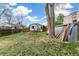 Large backyard with grass, trees, storage, swing set and picnic table at 2896 Depew St, Wheat Ridge, CO 80214