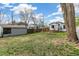 Backyard featuring grass, shed, swing set, picnic table and a large tree at 2896 Depew St, Wheat Ridge, CO 80214