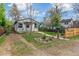 Charming single-story home with a cozy front porch and a well-maintained lawn with tidy landscaping at 2896 Depew St, Wheat Ridge, CO 80214
