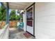 Welcoming front porch with chairs, offering a cozy space to relax and enjoy the neighborhood views at 2896 Depew St, Wheat Ridge, CO 80214