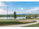 This scenic view showcases the peaceful water and walking path of Sloan's Lake Park at 2896 Depew St, Wheat Ridge, CO 80214