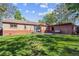 Expansive backyard with a well-maintained lawn, patio seating, and an outbuilding at 9301 Ciancio St, Thornton, CO 80229