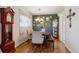 Cozy dining room features hardwood floors, chandelier lighting, and decorative wall art at 9301 Ciancio St, Thornton, CO 80229