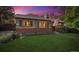 Inviting brick house with a neat lawn, garden decor, and an American flag proudly displayed at 9301 Ciancio St, Thornton, CO 80229