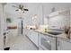 Bright kitchen featuring white cabinets, subway tile backsplash, and modern appliances at 9301 Ciancio St, Thornton, CO 80229