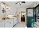 Bright kitchen featuring white cabinets and subway tile backsplash at 9301 Ciancio St, Thornton, CO 80229