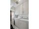 Functional laundry room with white washer, dryer, and overhead storage at 9301 Ciancio St, Thornton, CO 80229