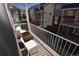 Relax on this spacious balcony with chairs and enjoy the community view at 17747 E 54Th Ave, Denver, CO 80249