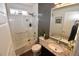 Bathroom featuring glass-enclosed shower, granite-topped vanity, and modern fixtures at 17747 E 54Th Ave, Denver, CO 80249