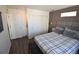 Stylish bedroom with closet and a designer headboard at 17747 E 54Th Ave, Denver, CO 80249
