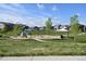 Inviting community park with play structures, swing set and gazebo for Gathering-friendly outdoor activities at 17747 E 54Th Ave, Denver, CO 80249