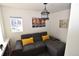 Cozy living area with a comfortable sectional sofa, natural light, and tasteful decor at 17747 E 54Th Ave, Denver, CO 80249