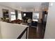 Open-concept living space with hardwood floors, modern decor, and access to outdoor area at 17747 E 54Th Ave, Denver, CO 80249