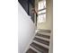 Stylish staircase with modern railing and bright, natural light at 17747 E 54Th Ave, Denver, CO 80249