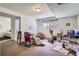 Unfinished basement area with carpet flooring, a window, and access to an unfinished bathroom at 4135 E 119Th Pl # A, Thornton, CO 80233