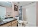 A bathroom featuring a shower-tub combo with decorative shower curtain and a single sink at 4135 E 119Th Pl # A, Thornton, CO 80233