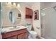 Bathroom features a vanity, a toilet, and a tiled glass door shower at 4135 E 119Th Pl # A, Thornton, CO 80233