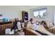 Bedroom with an exterior window; contains various furniture and items at 4135 E 119Th Pl # A, Thornton, CO 80233
