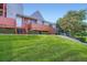Charming townhouse showcasing a front porch, complemented by a lush green lawn at 4135 E 119Th Pl # A, Thornton, CO 80233