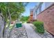 Townhouse exterior featuring landscaping and brick accents, adding visual appeal at 4135 E 119Th Pl # A, Thornton, CO 80233