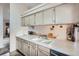 Kitchen features light countertops, lots of cabinet space, stainless steel dishwasher, and wood look flooring at 4135 E 119Th Pl # A, Thornton, CO 80233