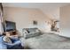Open living room and dining area with a vaulted ceiling, ideal for entertaining at 4135 E 119Th Pl # A, Thornton, CO 80233