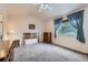 Spacious main bedroom features a ceiling fan, carpet flooring, a window, and vintage furniture at 4135 E 119Th Pl # A, Thornton, CO 80233