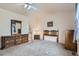 Spacious main bedroom features a ceiling fan, carpet flooring, and vintage furniture at 4135 E 119Th Pl # A, Thornton, CO 80233