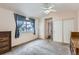 Spacious main bedroom features a ceiling fan, carpet flooring, a window, and vintage furniture at 4135 E 119Th Pl # A, Thornton, CO 80233