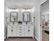 Elegant double vanity bathroom with modern white cabinets and plenty of counter space at 22196 Boar Head Rd, Indian Hills, CO 80454