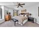 Spacious bedroom with a king-size bed and mountain views at 22196 Boar Head Rd, Indian Hills, CO 80454