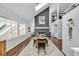 Open concept dining room with modern lighting and decor at 22196 Boar Head Rd, Indian Hills, CO 80454