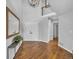 Bright and airy entryway with hardwood floors at 22196 Boar Head Rd, Indian Hills, CO 80454