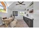 Home office with built-in shelving and a workspace at 22196 Boar Head Rd, Indian Hills, CO 80454