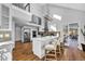 Modern kitchen with white cabinets, stainless steel appliances, and an island with seating at 22196 Boar Head Rd, Indian Hills, CO 80454