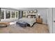 Spacious main bedroom with a king-size bed and large windows at 22196 Boar Head Rd, Indian Hills, CO 80454