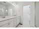 Bathroom with double sink, granite countertop, and vanity lights at 458 Millwall Cir, Castle Pines, CO 80108